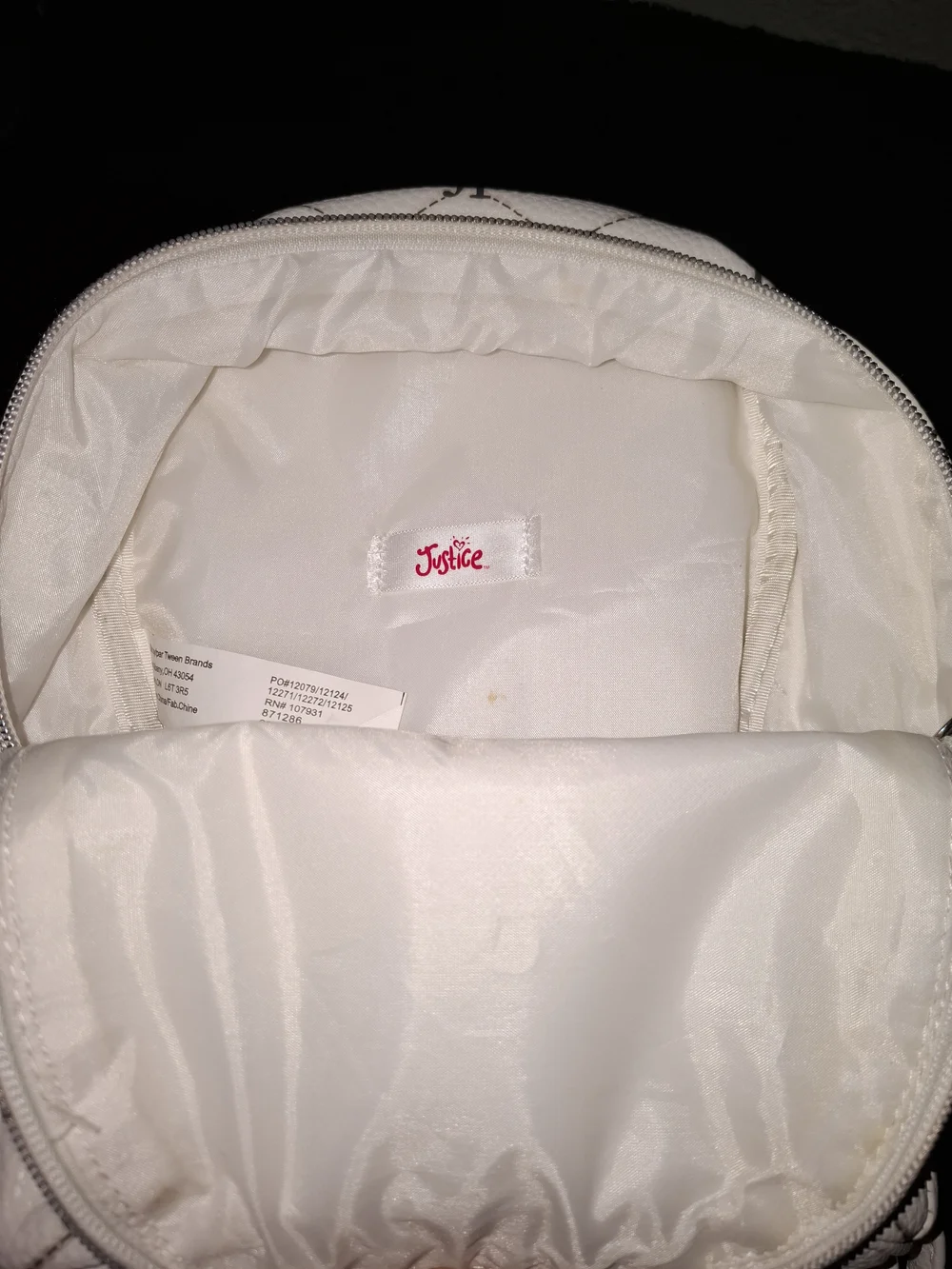 Justice mini backpack featuring an all-over 